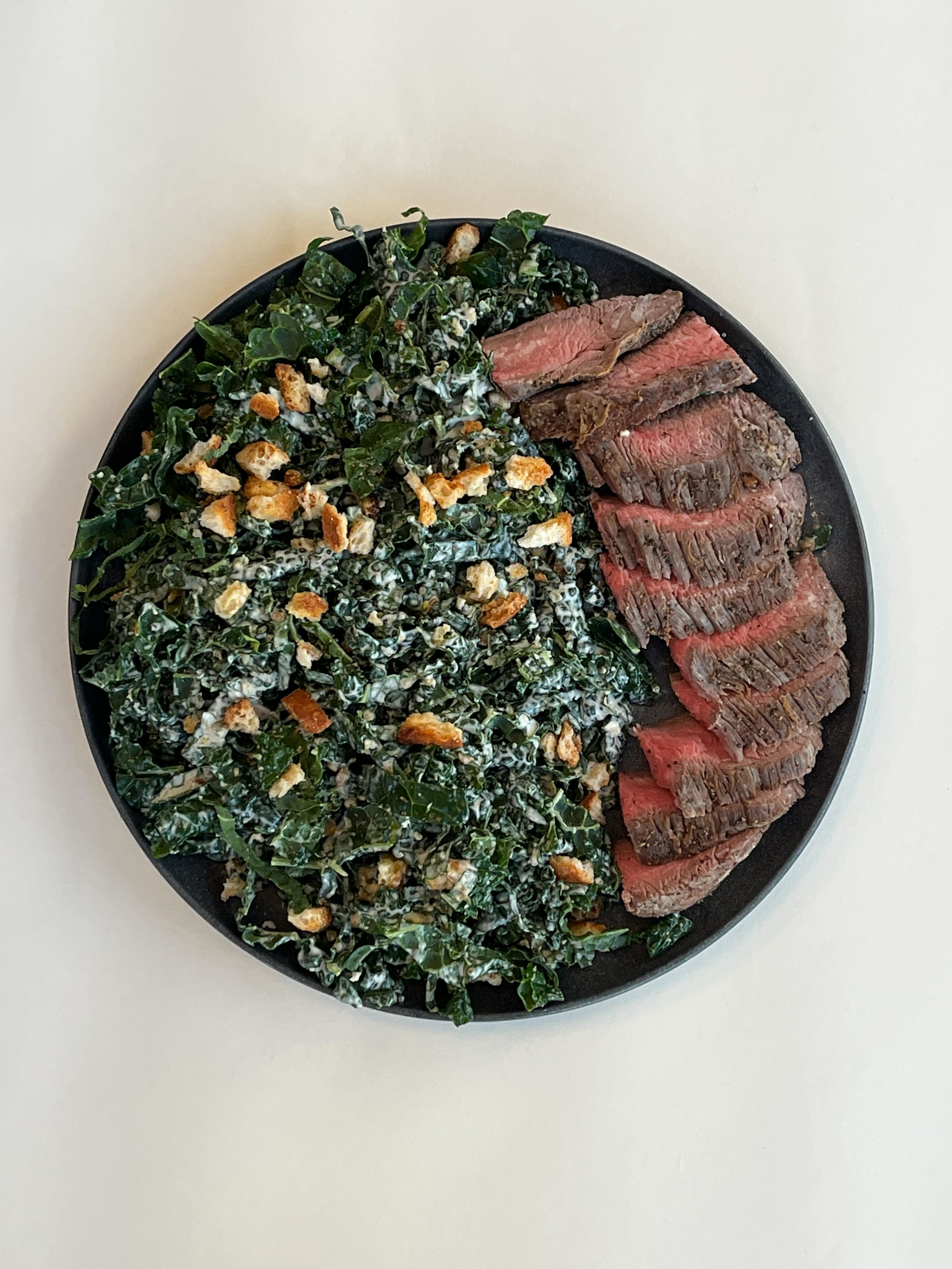 Grilled Hanger Steak over Kale Caesar Salad