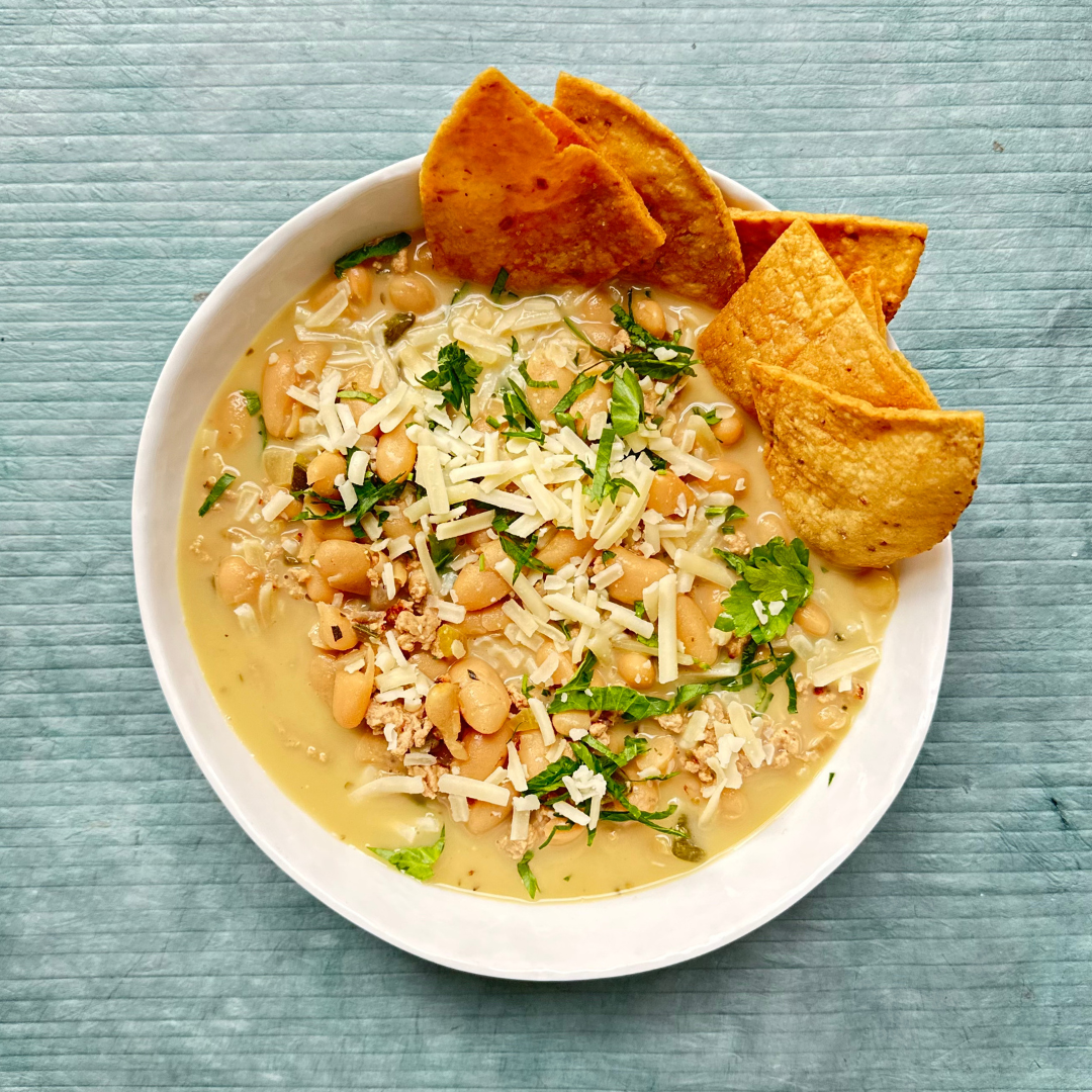 White Bean and Turkey Chili with Homemade Tortilla Chips and Shredded Cheddar