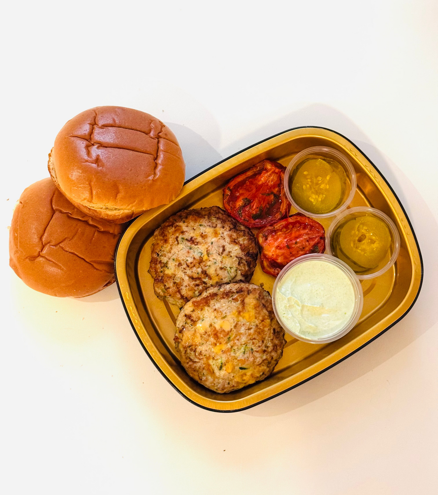 Zucchini Chicken Burgers with House Pickles, Roasted Tomatoes, and Green Goddess Dressing