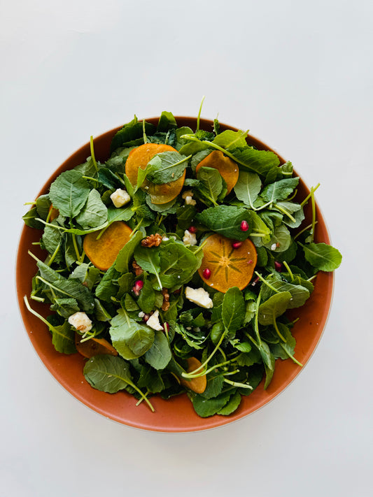 Baby Kale Salad with Persimmon, Walnut, and Aged Cheddar