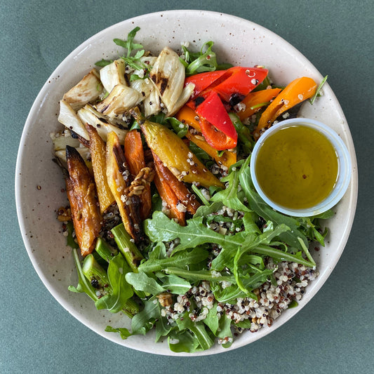 Desk Lunch: Spring Quinoa Bowl with Roasted Vegetables, Arugula, and Turmeric-Spiced Seeds