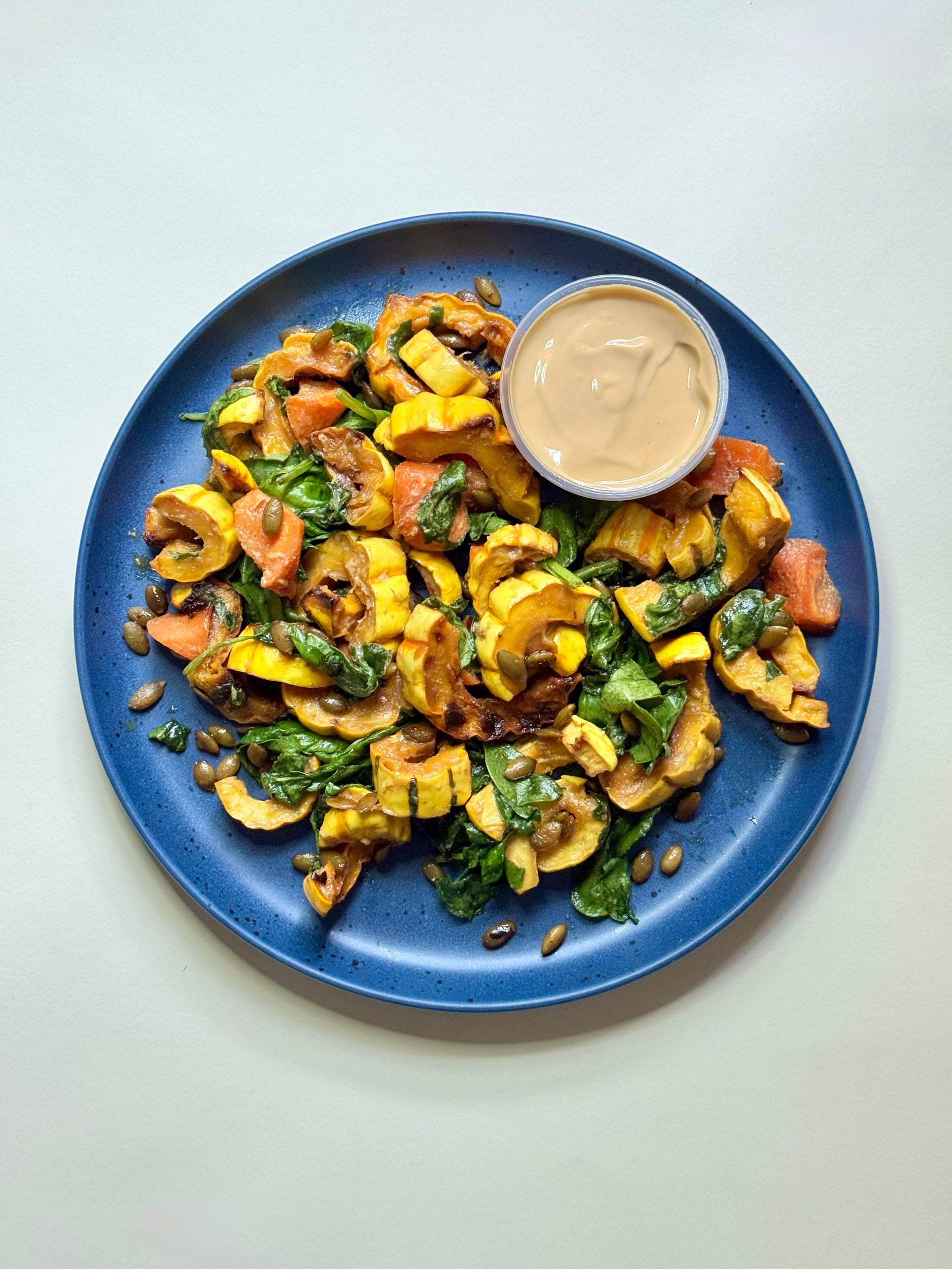 Miso Delicata Squash with Organic Baby Spinach & Spicy Pumpkin Seeds