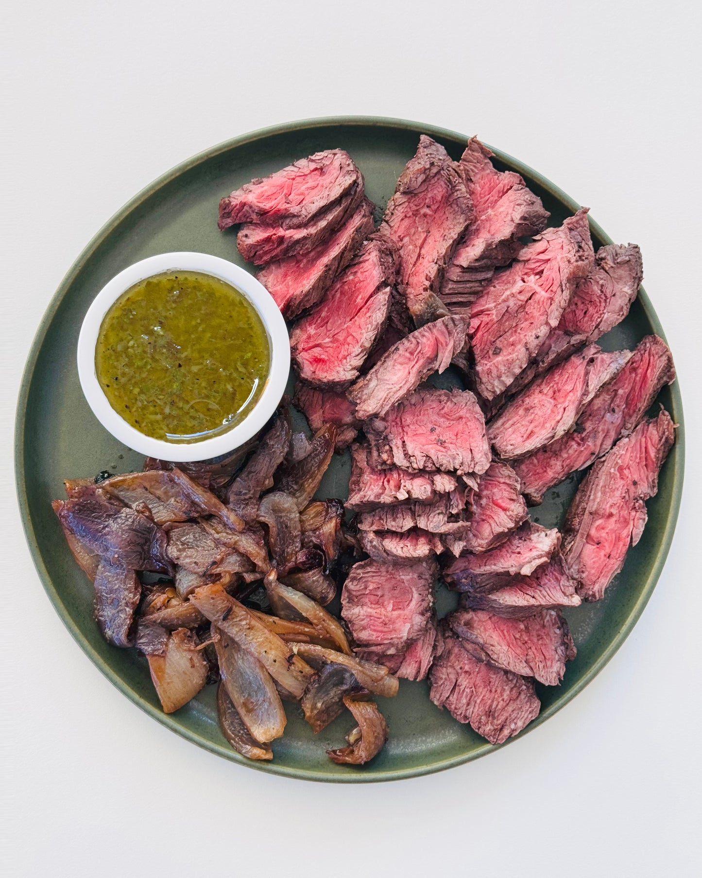 Prime Hanger Steak with Charred Scallion Vinaigrette and Red Onions
